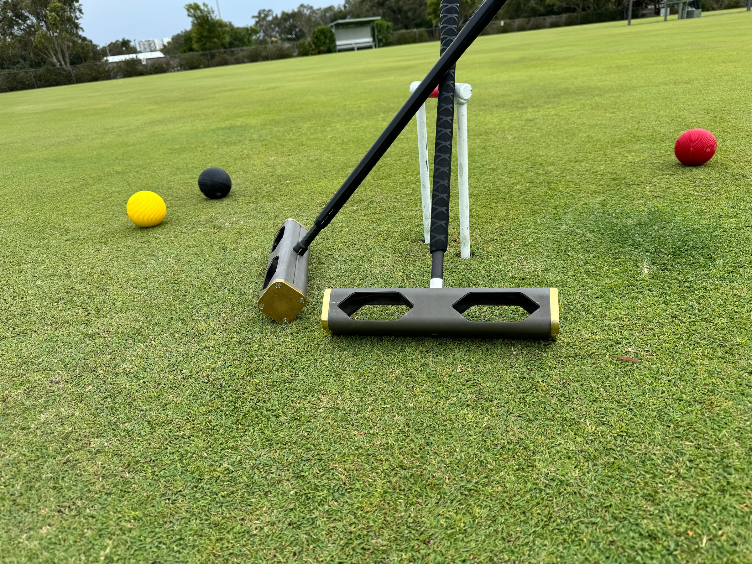 Invictus competition croquet mallet on a croquet lawn
